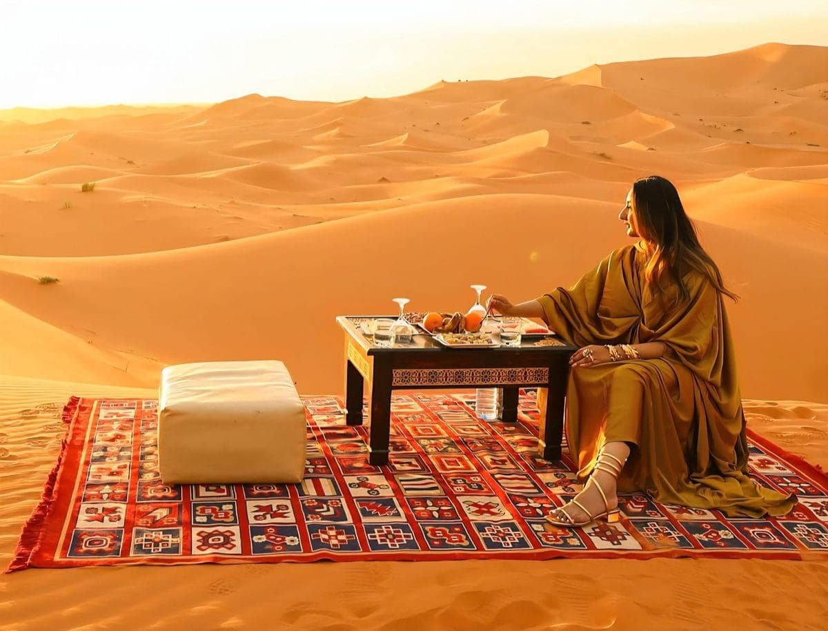 Camel trekking across the golden dunes of Merzouga during the Marrakech Desert Tours 3 Days